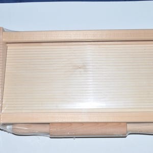 Large wooden pasta cutter guitar with rolling pin. Measures 43 x 22 cm