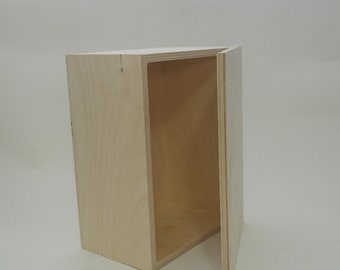May include: A plain wooden box with a hinged lid, open to reveal the empty interior. The box is made of light-colored wood and has a natural finish.