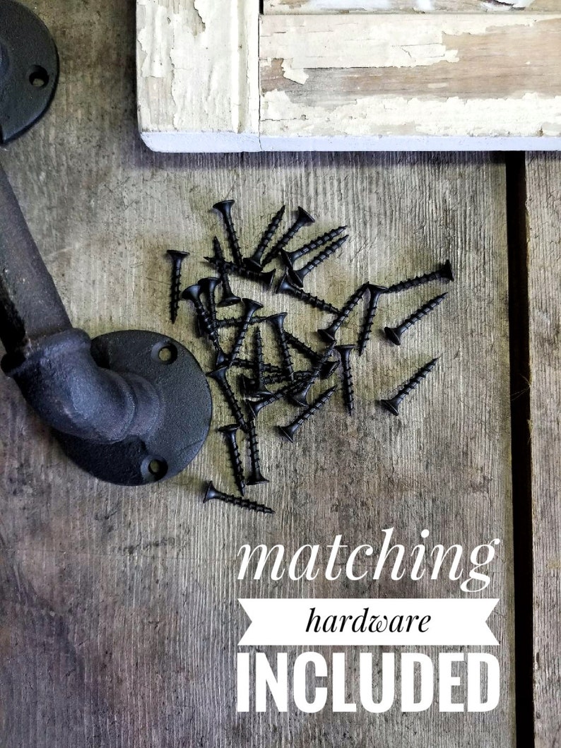 May include: Black screws scattered on a weathered wooden surface, alongside a black metal pipe fitting and a section of a distressed, white-painted wooden frame. The text "matching hardware INCLUDED" is displayed.