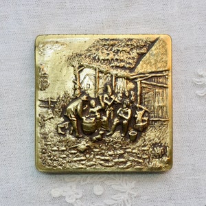 Vintage 1920s – 1950s repoussé brass mirror powder compact