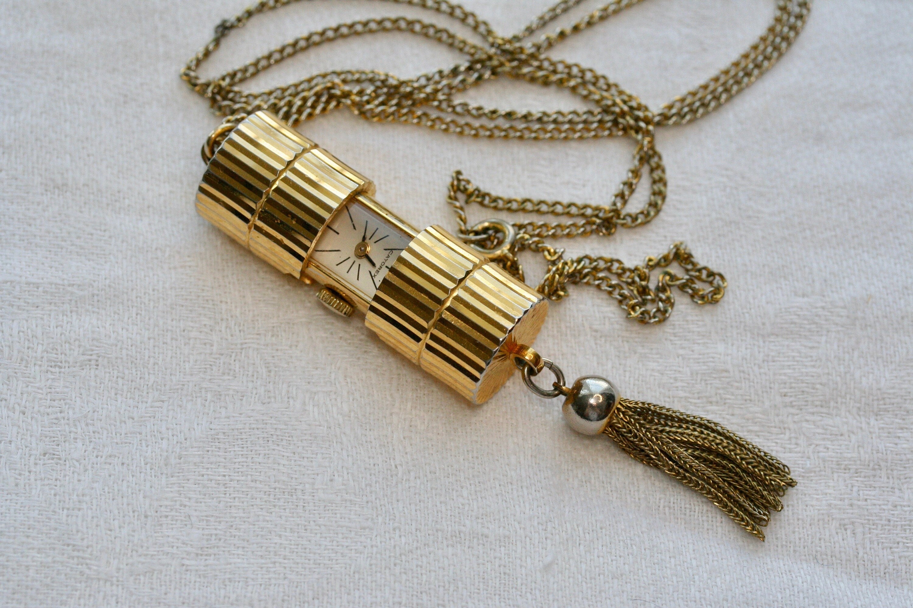 Vintage c1970s gold tone Swiss Catorex sliding wind up fob watch pendant with tassel drop necklace