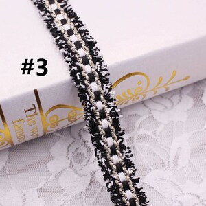 May include: Black and white trim with a silver thread running through it. The trim has a fringe on both sides. #3