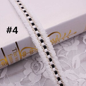 May include: White trim with black and gold stripes. The trim has a fuzzy texture. #4