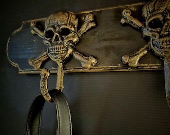 Gothic style cast iron hooks on wood  base for coats, mugs, dog leashes