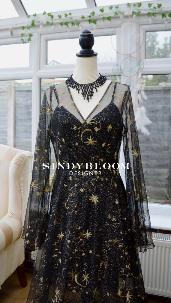 black dress with gold stars Raya Sun Black Animal Print Hem Sleeveless Dress - Black main image 1