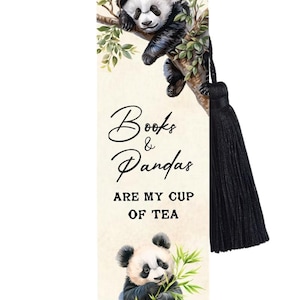 May include: A rectangular bookmark featuring a black and white panda resting in a tree and another panda eating bamboo. The text reads Books & Pandas ARE MY CUP OF TEA. The bookmark has a cream-coloured background and a black tassel attached at the top.