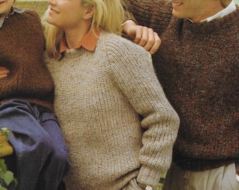 May include: A family wearing brown, beige, and cream knit sweaters. The sweaters have a textured knit pattern.