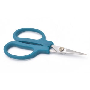 May include: Teal-colored scissors with silver blades. The scissors have a small screw in the center of the blades.