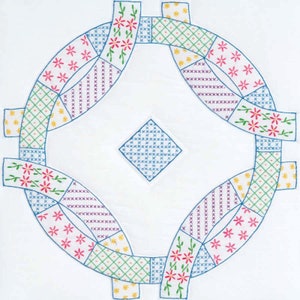 May include: A white fabric with a blue embroidered design. The design features a diamond shape in the center surrounded by four curved shapes. The curved shapes are made up of smaller squares in various colors, including green, yellow, pink, and purple.
