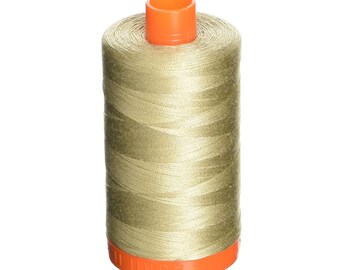 May include: A spool of beige thread with an orange plastic bobbin.