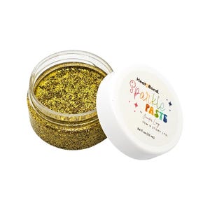 May include: A clear jar filled with gold glitter paste, with the lid slightly off to the side. The lid is white with the words "HeatnBond Sparkle Paste" in a rainbow font. The jar contains 84 fl oz (25 ml) of glitter paste.