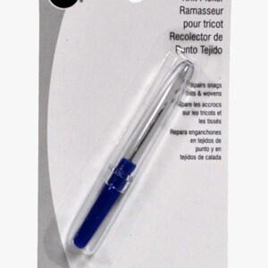 May include: A Dritz Knit Picker tool for repairing snags in knit and woven fabrics. The tool has a blue handle and a silver needle, packaged on a white and gray card. Text on the card includes "Knit Picker" and instructions in multiple languages.