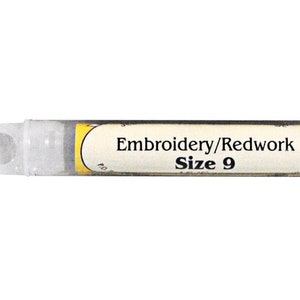 May include: A clear plastic tube with a yellow label that reads "Embroidery/Redwork Size 9".