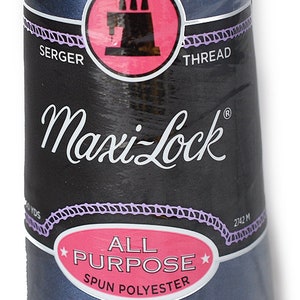 May include: A spool of Maxi-Lock All Purpose Spun Polyester Serger Thread in a dark blue colour. The spool is labelled with the brand name and the type of thread. The spool is 2742 metres long.