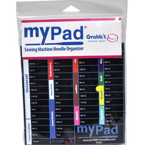 May include: A white sewing machine needle organizer with a black background and blue lettering. The organizer has a grid with different needle sizes and types, including universal, embroidery, hemstitch, leather, jeans/denim, metallic, quilt, micro, stretch, and topstitch. The organizer is labeled "myPad Grabbit Sewing Tools" and "www.SCHMETZneedles.com ©2021".