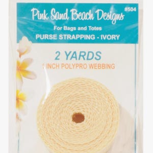 May include: A roll of ivory-colored polypro webbing for purse strapping, packaged in a clear plastic bag. The label reads Pink Sand Beach Designs, #504, For Bags and Totes, PURSE STRAPPING - IVORY, 2 YARDS, and 1 INCH POLYPRO WEBBING.