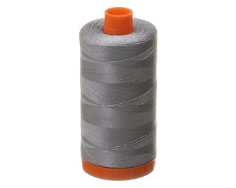 May include: A spool of gray thread with an orange plastic top and bottom.