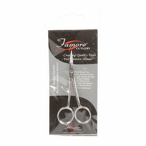 May include: Silver embroidery scissors with a double curved blade, packaged in a black and silver plastic wrapper. The packaging features the text "Famore Cutlery" and "Creating Quality Tools for Creative Minds!"