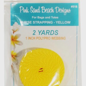 May include: A coil of bright yellow 1 inch wide polypro webbing for bags and totes, packaged in a clear plastic bag labeled Pink Sand Beach Designs #518, containing 2 yards of material with a floral graphic on the left side of the packaging.