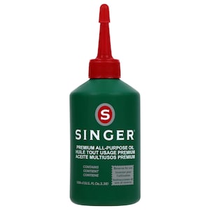 May include: A green Singer all-purpose oil bottle with a red cap and nozzle. The bottle has white text that reads "SINGER PREMIUM ALL-PURPOSE OIL". The bottle contains 100ml (U.S. FL Oz. 3.38).