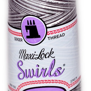 May include: A spool of gray and white serger thread with the text "Maxi-Lock Swirls" and "Decorative Spun Polyester" on the label.