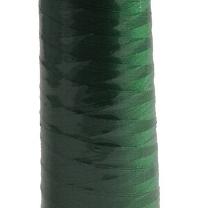 May include: A spool of green thread with the text "8500 2000 yds" on the label.