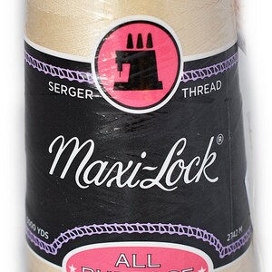 May include: A spool of beige Maxi-Lock All Purpose Spun Polyester thread for sergers. The spool is labeled with the brand name, thread type, and yardage. It is 2742 meters or 3000 yards.