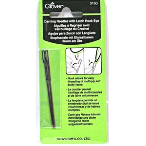 May include: A package of two black darning needles with latch hook eyes. The package is green and white and has instructions on how to use the needles. The text on the package reads "Darning Needles with Latch Hook Eye" and "Clover Mfg. Co., Ltd."