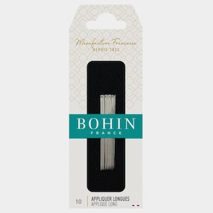 May include: A package of Bohin France appliqué needles. The package is white with a black rectangular insert holding the needles. The brand name and "Manufacture Française Depuis 1833" are printed on the package.