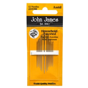 May include: A yellow and white package of 12 assorted needles from John James, a company established in 1840. The package says "Household Assorted" and "Finest Quality Needles".