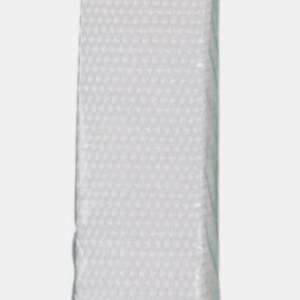 May include: A white woven webbing strap packaged in a clear plastic sleeve with a header card. The header card features the text byannie.com and Purse Parts. The strap has a textured, grid-like surface and is designed for use in bag construction.