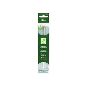 May include: A close-up of a Clover Takumi bamboo crochet hook in size F (3.75 mm). The hook is packaged in a clear plastic sleeve with a green and white label.