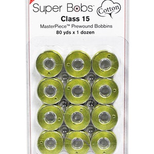 May include: A package of 12 green Super Bobs Class 15 Cotton MasterPiece Prewound Bobbins, 80 yards each. The package is labeled "New!" and "Cotton".