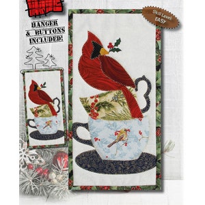 May include: A quilting pattern for a cardinal sitting in a coffee cup. The pattern is called "Coffee With a Cardinal" and is 15.2 cm by 30.5 cm. The pattern is easy to follow and includes a hanger and buttons.
