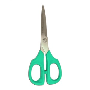 May include: A pair of small, silver scissors with teal green plastic handles. The scissors have a small screw in the center of the handles and the words "S221 V116 Made in Japan" are printed on the blade.