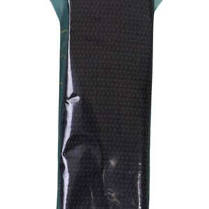 May include: A black woven strap packaged in a clear plastic bag with a header card labeled byannie.com and Purse Parts. The strap is a flat, textured, solid black material designed for use as a handle or shoulder strap for bags and purses.