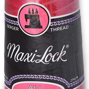 May include: A spool of Maxi-Lock All Purpose Spun Polyester Serger Thread in a vibrant pink colour. The spool is labelled with the brand name and the type of thread. The spool is 2742 metres long.