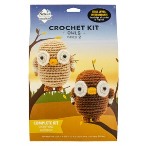 May include: Crochet kit to make two brown and beige owls. The kit includes everything needed to make the owls, which are approximately 4 inches tall. The kit is labeled "Crochet Kit - Owls - Makes 2".