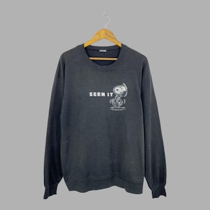 Sweat-shirt Snoopy vintage années 90 « Vu » à col rond, taille L, motif Peanuts, style streetwear délavé et usé.
