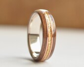 Walnut wood ring with golden flakes and double copper inlays on sterling silver core. Wood wedding or engagement ring for men and women
