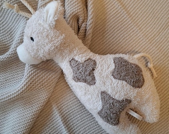 Musical toy, small giraffe, sand-colored, with your choice of melody.