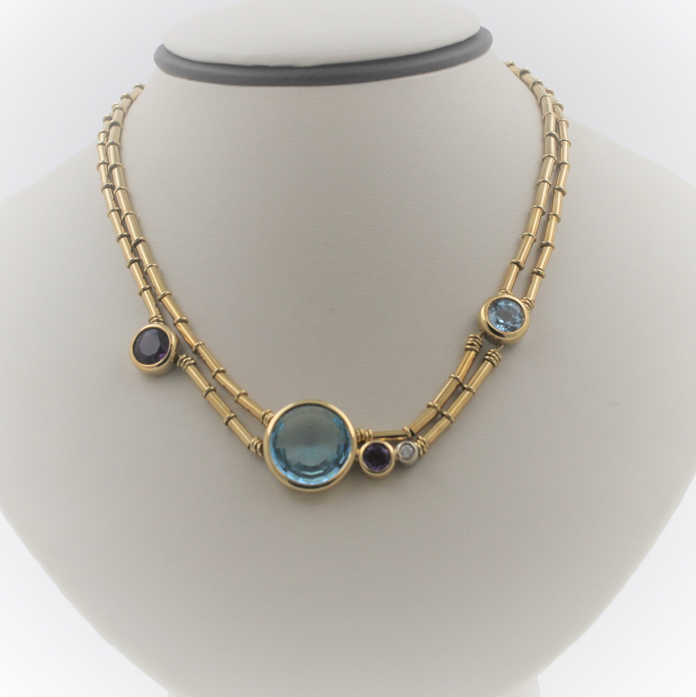 Handmade Vintage 18K Yellow Gold Designer Manfredi Necklace With Round Shaped Blue Topaz, Amethyst, and Diamond.