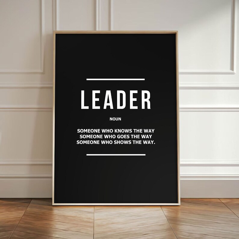 May include: Black and white typography poster with the word "LEADER" defined as "someone who knows the way, someone who goes the way, someone who shows the way."
