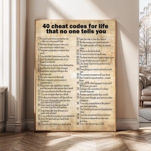 May include: A framed print with the text "40 cheat codes for life that no one tells you" in black font. The print has a vintage, aged paper appearance and is displayed on a wall. The text is organized in numbered points.