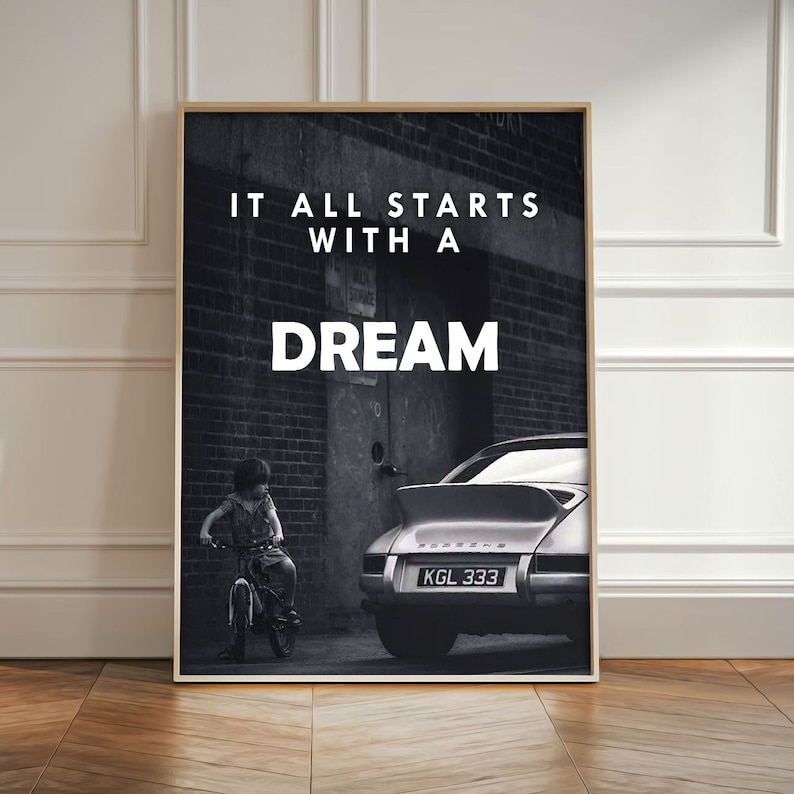 May include: Black and white photo of a child riding a bicycle in front of a brick wall with the text "It all starts with a dream" and a silver Porsche with the license plate "KGL 333".