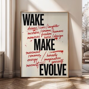 May include: A rectangular wall art print featuring the black text WAKE, MAKE, and EVOLVE in a bold sans-serif font. Between these words are smaller, handwritten-style red words including dreams, scars, laughter, mistakes, cinema, humans, memories, freedom, noise, design, movement, romance, honesty, imagination, and yourself.