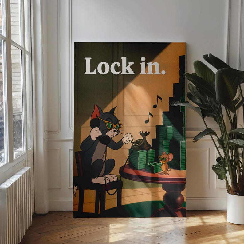 May include: A framed canvas print featuring a cartoon cat wearing sunglasses and using a rotary phone. The print includes the text "Lock in." and a cartoon mouse. The background is a warm, vintage-style interior.