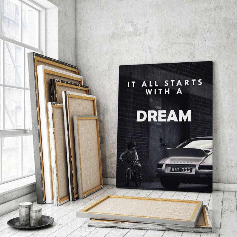 May include: A black and white motivational poster with the text "It all starts with a dream" and a photo of a child riding a bicycle in front of a vintage Porsche.