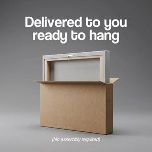 May include: A rectangular canvas print with a wooden frame and a metal sawtooth hanger on the back, partially inside a brown cardboard box. The text "Delivered to you ready to hang" and "(No assembly required)" is printed in white.