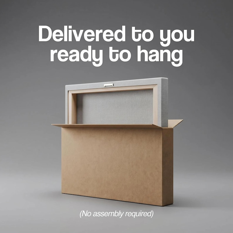 May include: A rectangular canvas print with a wooden frame and a metal sawtooth hanger on the back, partially inside a brown cardboard box. The text "Delivered to you ready to hang" and "(No assembly required)" is printed in white.